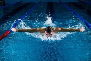 man doing butterfly stroke