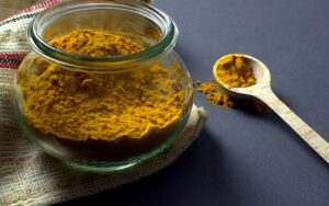 turmeric powder in glass jar