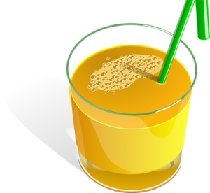 glass of orange juice with a green straw