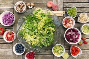 bowls of raw salad and vegetables