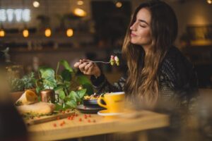 woman eating at table