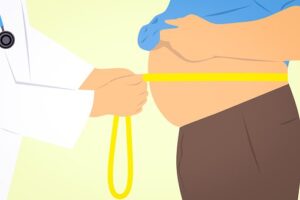 obese man with tape measure around his belly