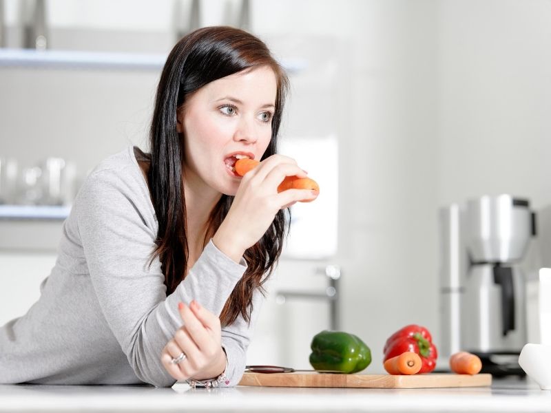 woman eating carrot