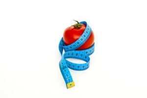 tape measure wrapped around a tomato