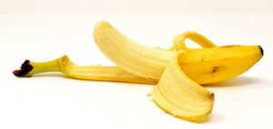 ripe peeled banana with skin