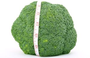 raw broccoli with tape measure