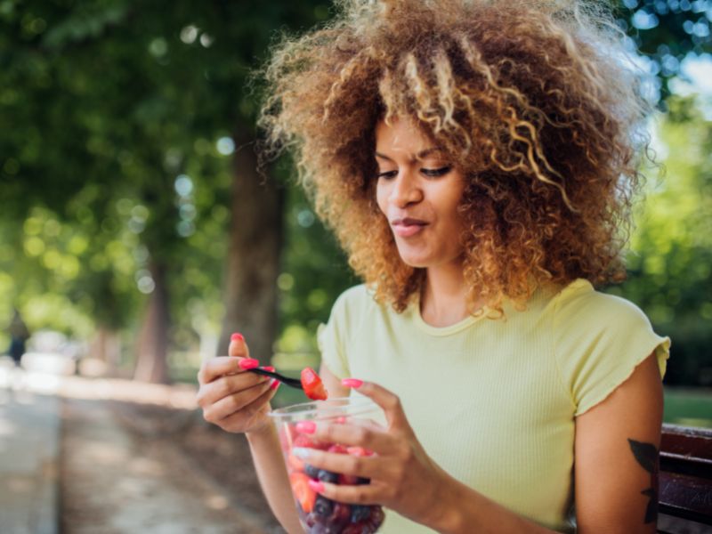 woman eating fruit