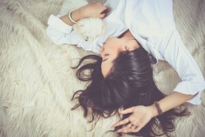 girl asleep on bed