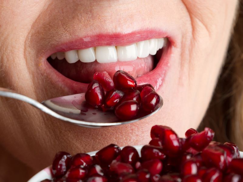 woman eating pomegranate