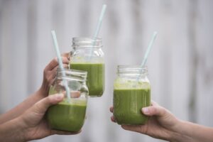 clear glasses of green smoothie