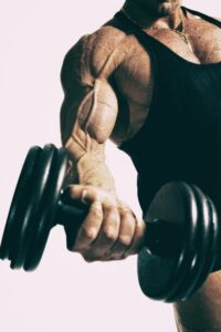 man lifting dumbell