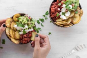 bowl of chili and avocado