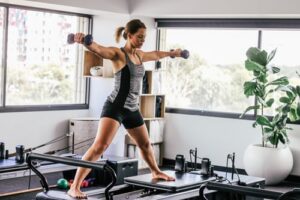 woman using dumbells