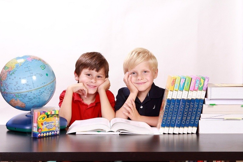 two boys with books