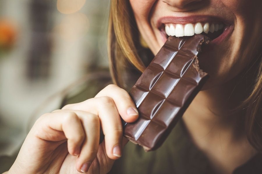 woman eating dark chocolate